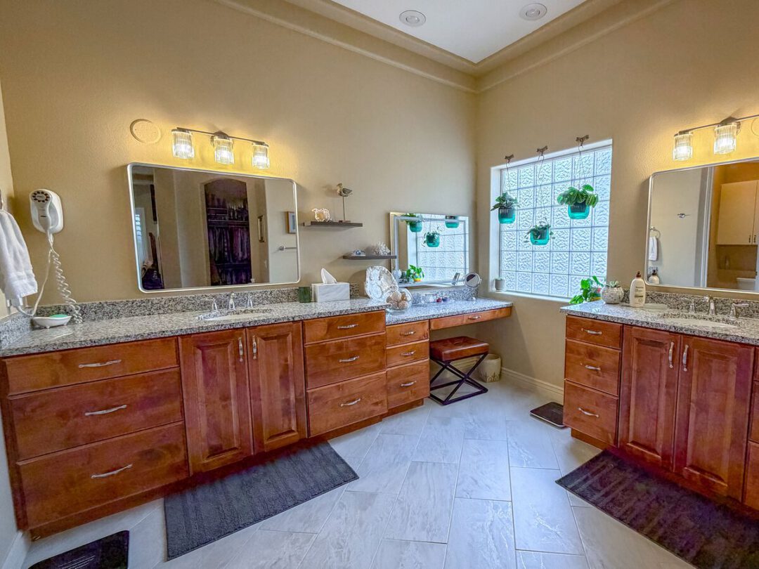 Master bathroom with a double vanity and a seated makeup station